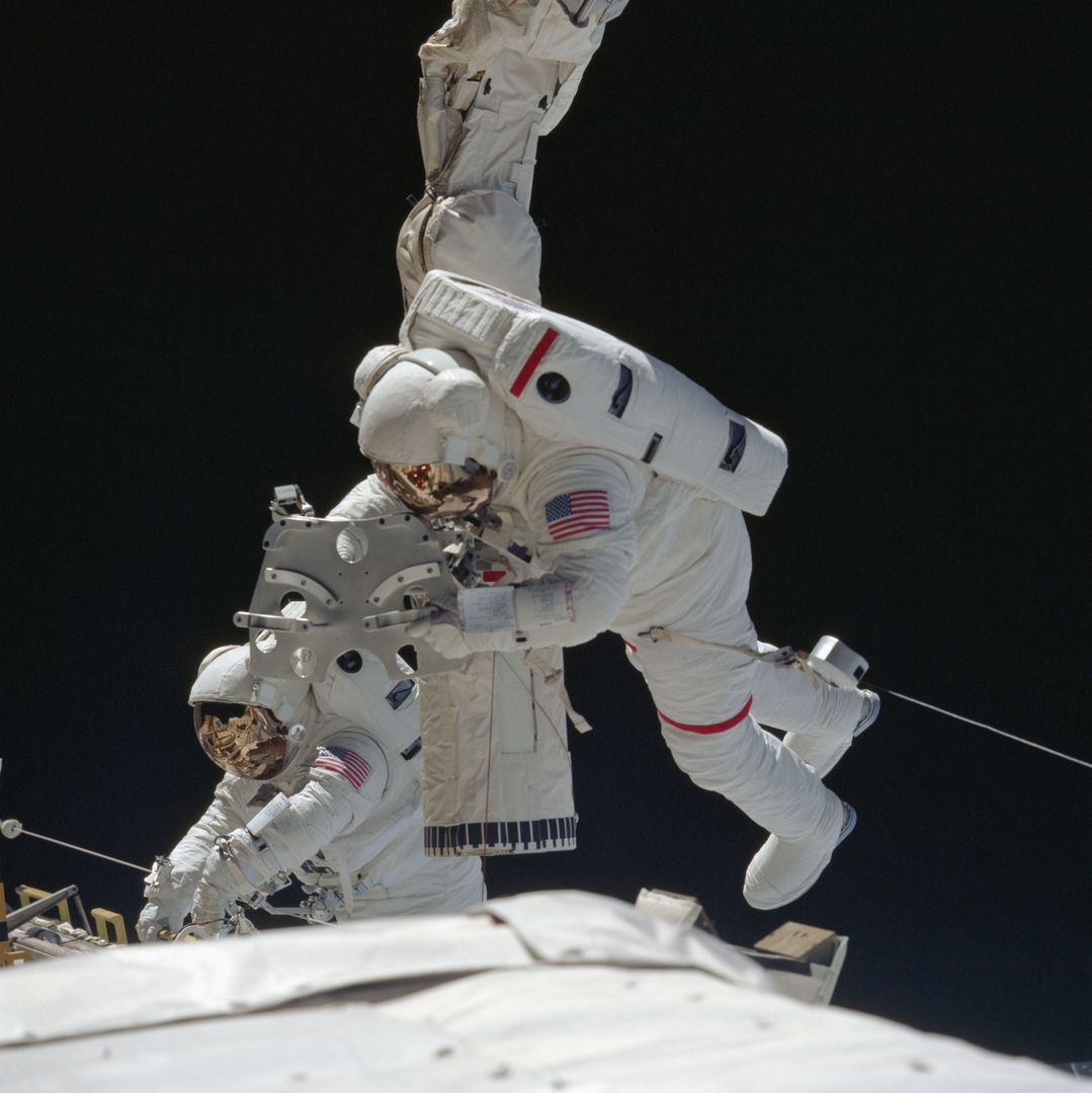 Astronauts Performing Extravehicular Activity near Space Shuttle Endeavour - Free Images, Stock Photos and Pictures on Pikwizard.com