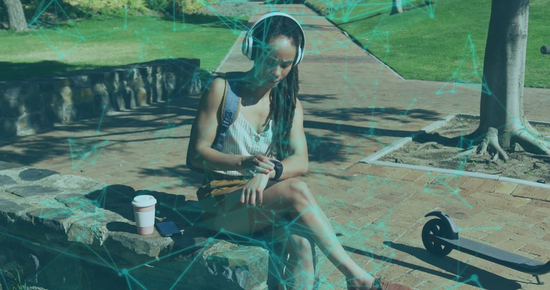 Woman Engaging with Smartwatch Technology in Park