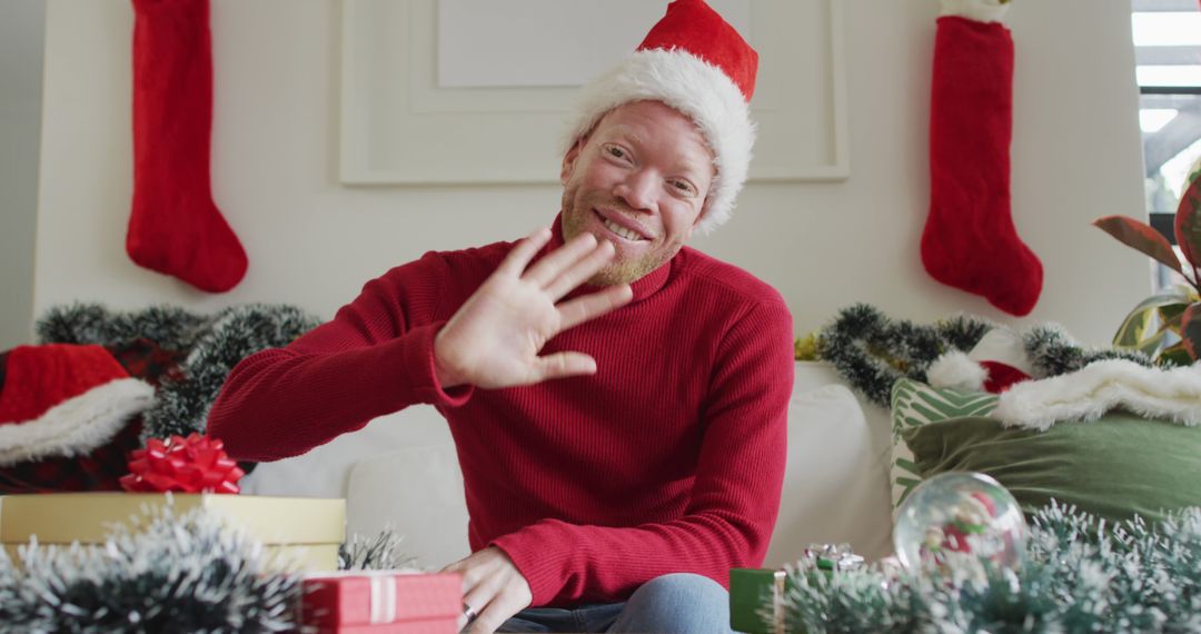 Happy Man in Red Sweater Celebrating Christmas - Free Images, Stock Photos and Pictures on Pikwizard.com