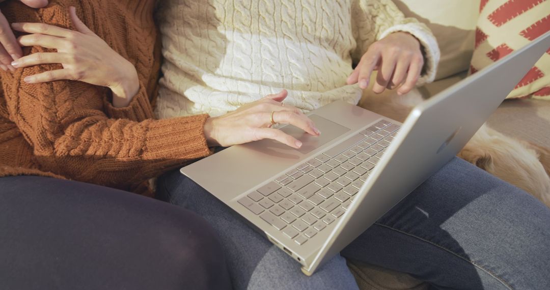 Couple Bonding While Sharing Laptop on Cozy Couch