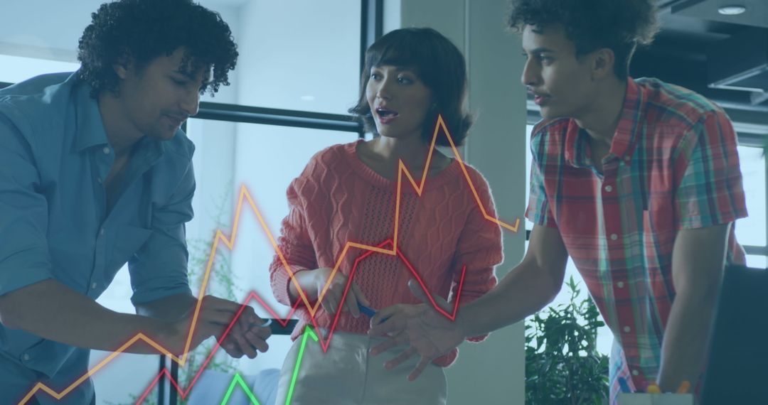 Colleagues Analyzing Business Data Trends in Modern Office