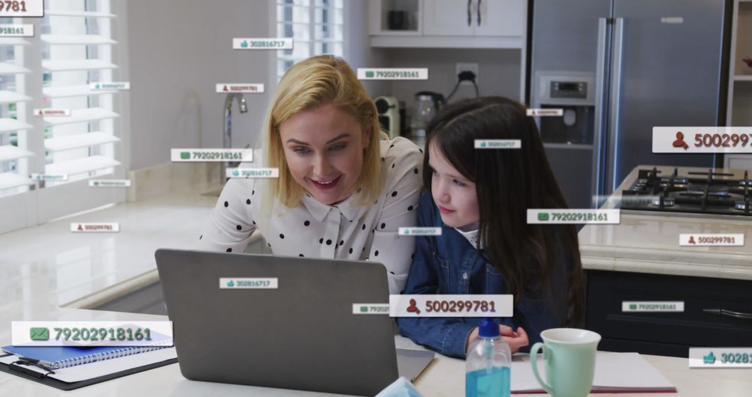 Mother and Daughter Using Laptop in Kitchen Study Session