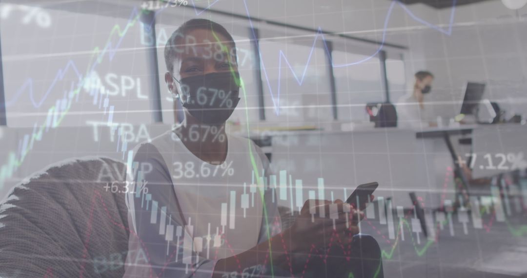 Masked Businesswomen Engaged in Financial Data Analysis