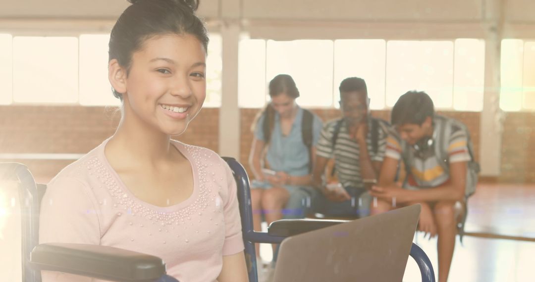 Happy Biracial Female Student Using Laptop in Diverse School Environment