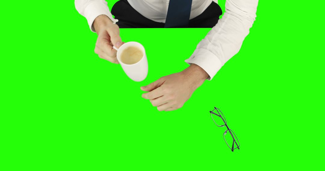 Businessman Reaching for Coffee in Morning Routine - Free Images, Stock Photos and Pictures on Pikwizard.com