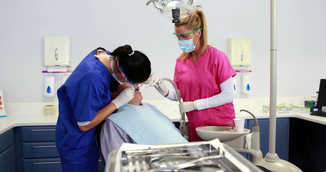 Dentists in Uniform Providing Patient Dental Care in Clinic - Free Images, Stock Photos and Pictures on Pikwizard.com