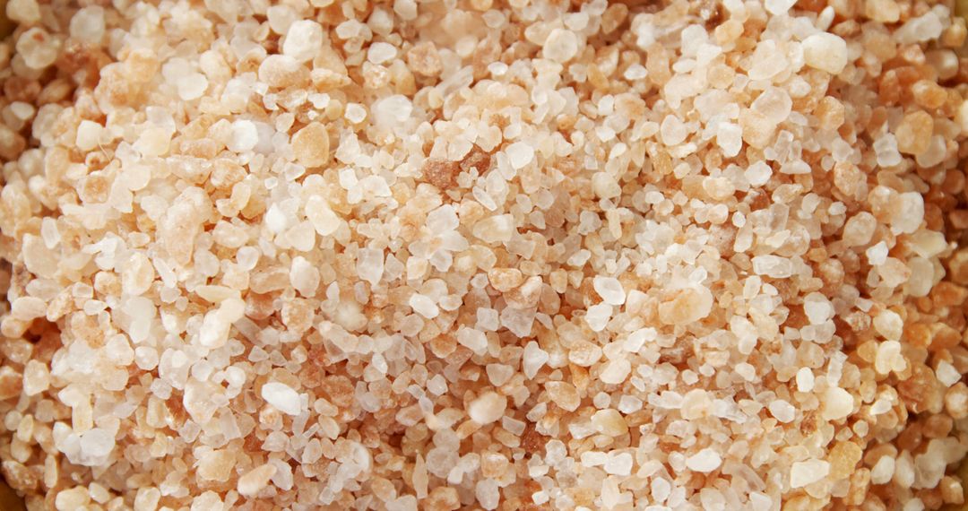Close-up view of coarse Himalayan pink salt, showcasing its unique color and texture - Free Images, Stock Photos and Pictures on Pikwizard.com