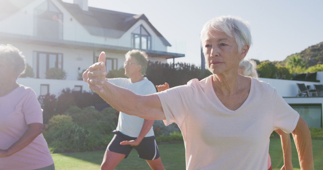 Seniors Practicing Tai Chi Outdoors in Sunlight - Free Images, Stock Photos and Pictures on Pikwizard.com