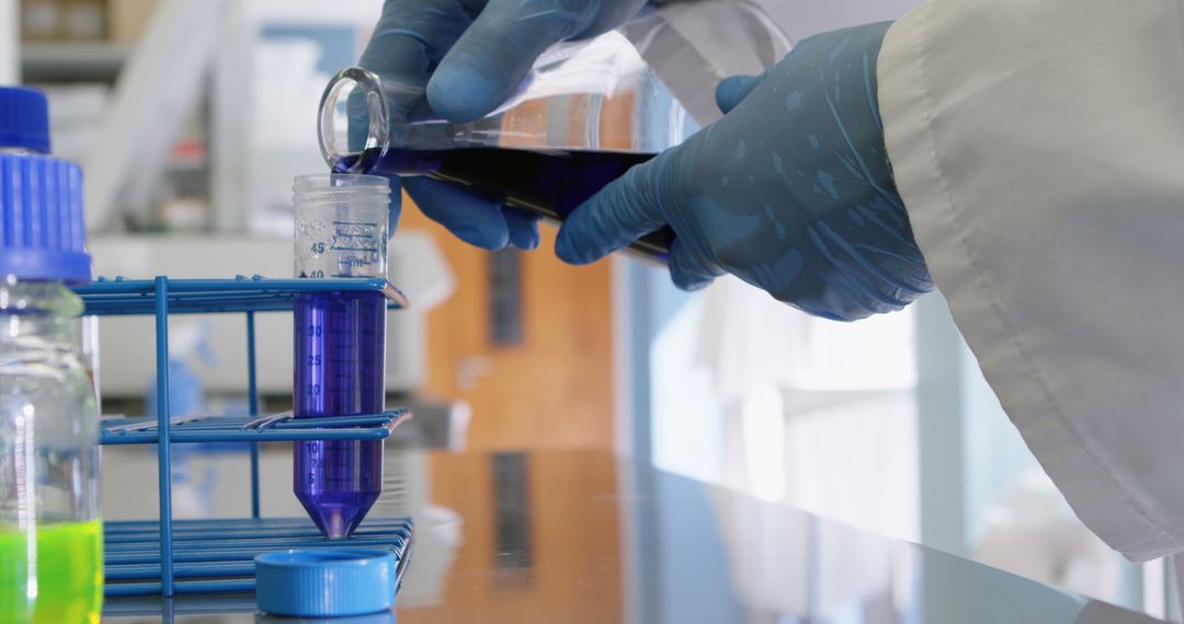 Scientist Pouring Liquid into Test Tube in Laboratory - Free Images, Stock Photos and Pictures on Pikwizard.com