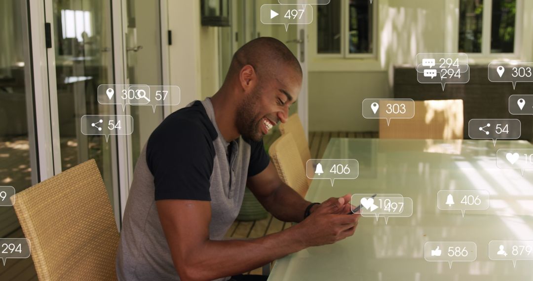 Laughing Man Using Smartphone Surrounded by Social Media Icons