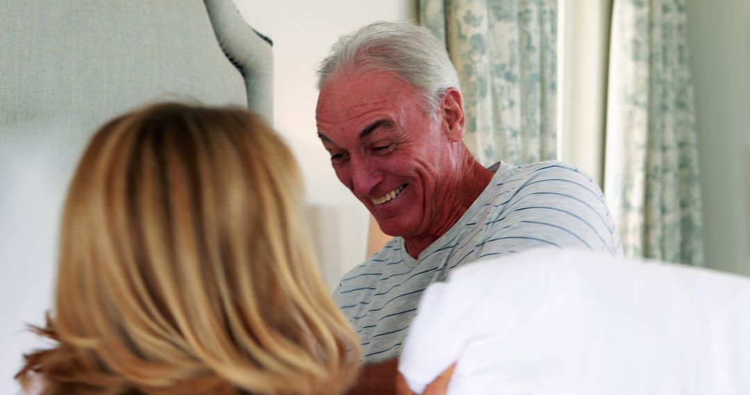 Senior Couple Laughing in Bedroom, Enjoying Morning - Free Images, Stock Photos and Pictures on Pikwizard.com