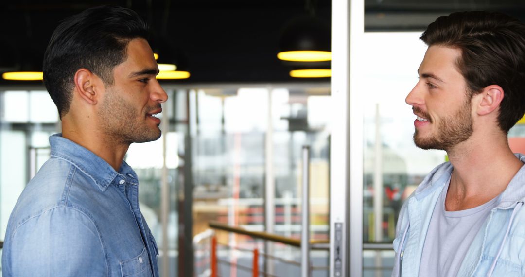 Casual Conversation Between Male Colleagues in Office Environment