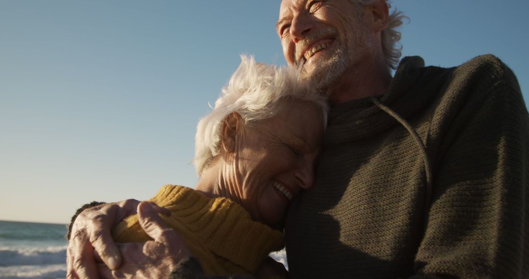 Senior Couple Embracing Outdoors at Sunset - Free Images, Stock Photos and Pictures on Pikwizard.com