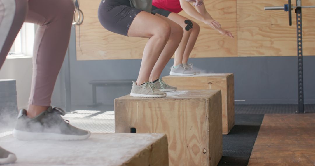 People Doing Box Jumps During Fitness Training in Gym - Free Images, Stock Photos and Pictures on Pikwizard.com