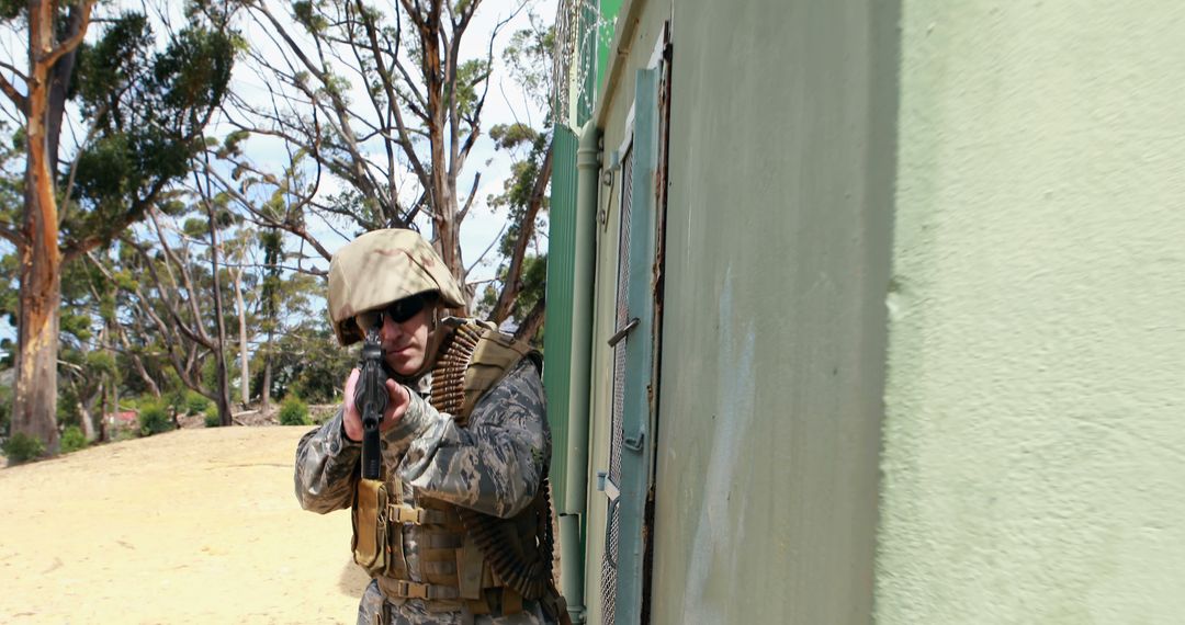 Soldier in combat gear holding rifle on high alert - Free Images, Stock Photos and Pictures on Pikwizard.com