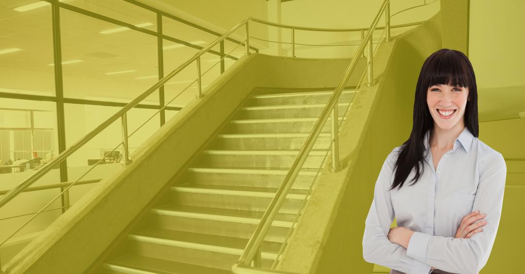 Confident Businesswoman In Front Of Office Staircase - Free Images, Stock Photos and Pictures on Pikwizard.com