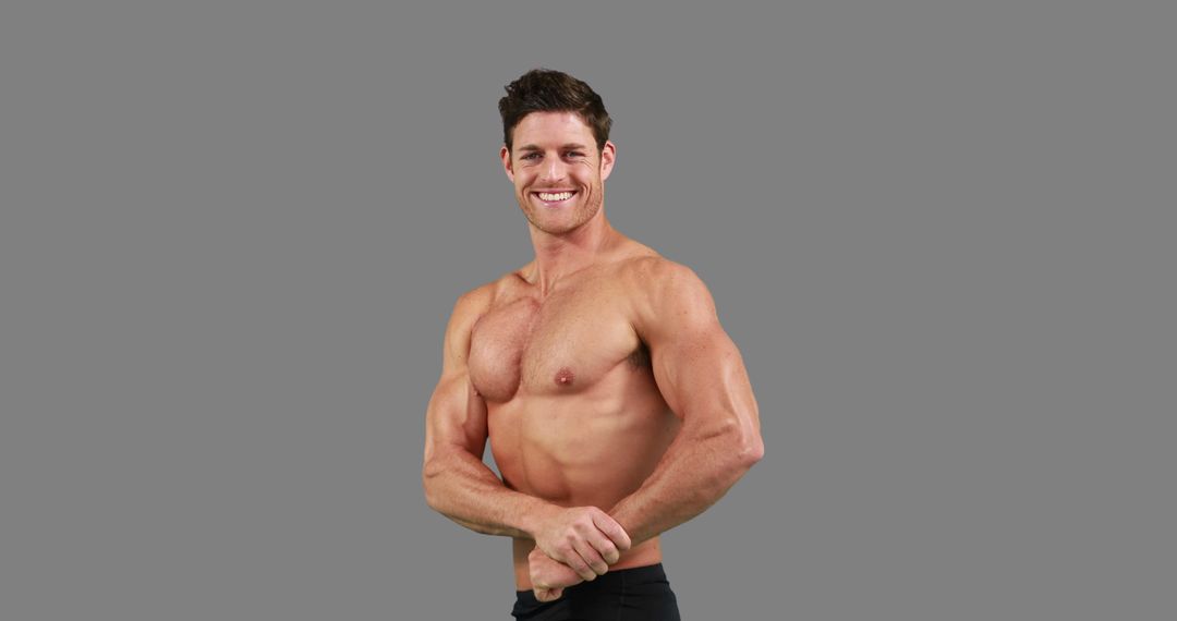 Fit Man Smiling Shirtless Flexing Muscles Arm Cross Outdoor Background - Free Images, Stock Photos and Pictures on Pikwizard.com