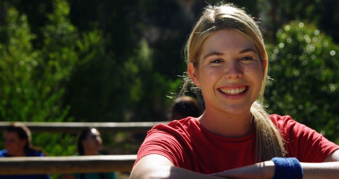 Smiling Young Woman in Outdoor Park - Free Images, Stock Photos and Pictures on Pikwizard.com