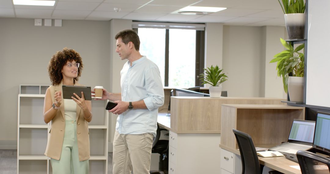 Diverse Coworkers Collaborate in Modern Office Environment