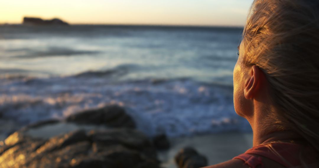 Woman Watching Sunset by Ocean Shore, Feeling Calm and Peaceful - Free Images, Stock Photos and Pictures on Pikwizard.com