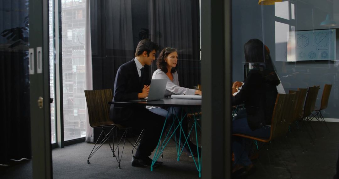 Professional Team Collaborating at Corporate Office Conference Table