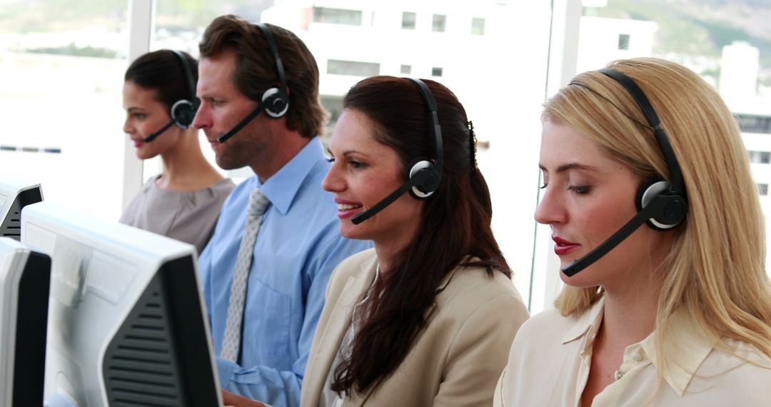 Focused Customer Service Representatives Assisting Clients