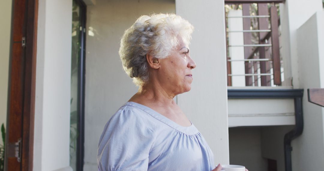 Senior Woman Enjoying Morning Coffee on Balcony - Free Images, Stock Photos and Pictures on Pikwizard.com