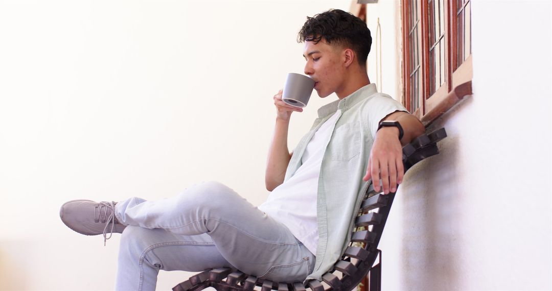 Man Relaxing with Coffee on Bench in Contemplative Mood
