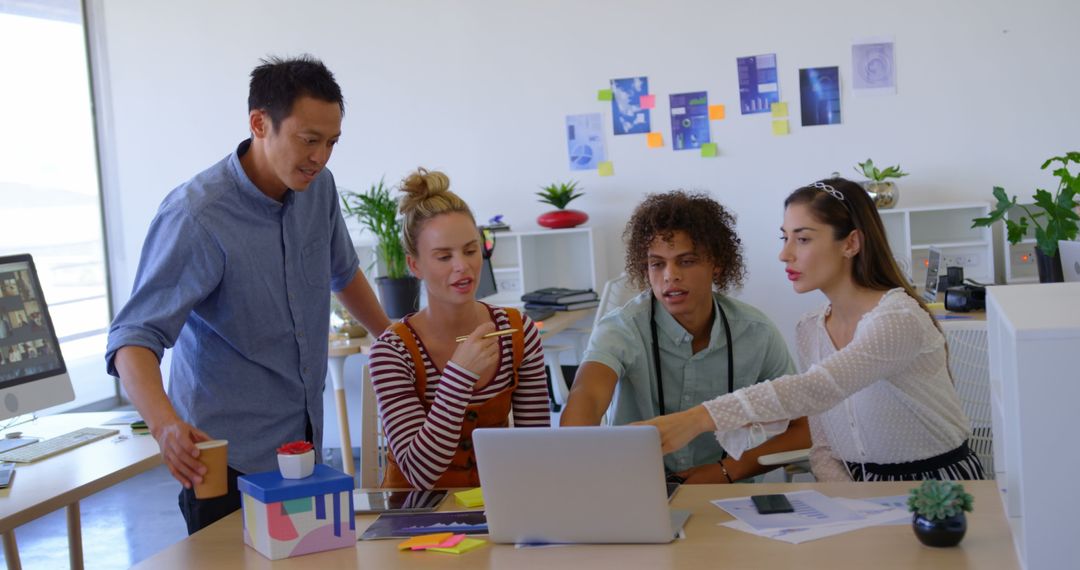 Diverse Team Collaborating on Innovative Project in Contemporary Office