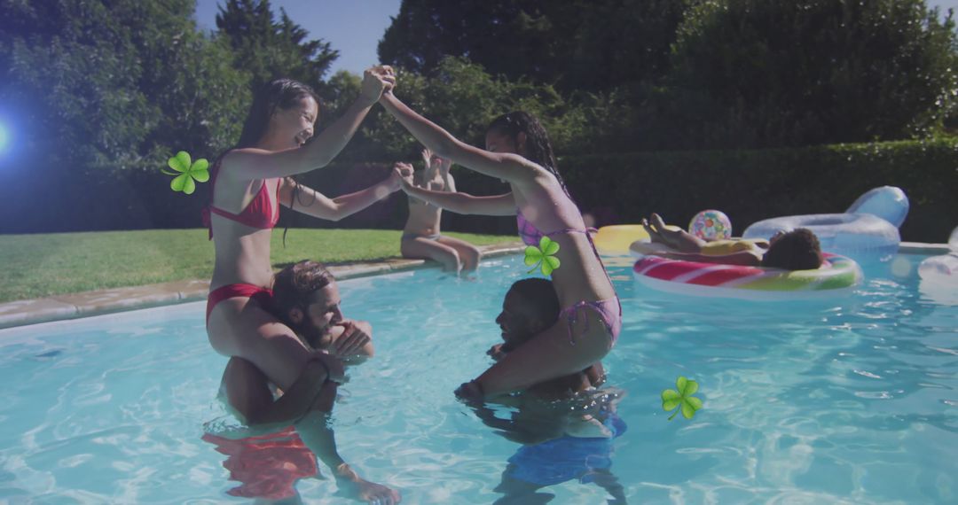 Friends playing shoulder game in refreshing pool