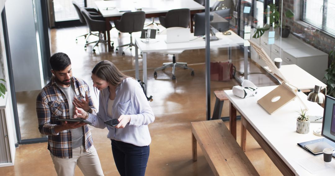 Connected Coworkers Analyzing Data on Office Tablet