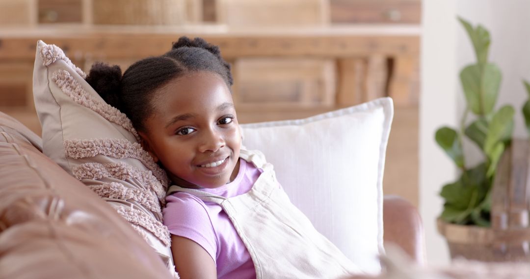 Smiling Child Relaxing on Comfortable Sofa in Cozy Home Setting