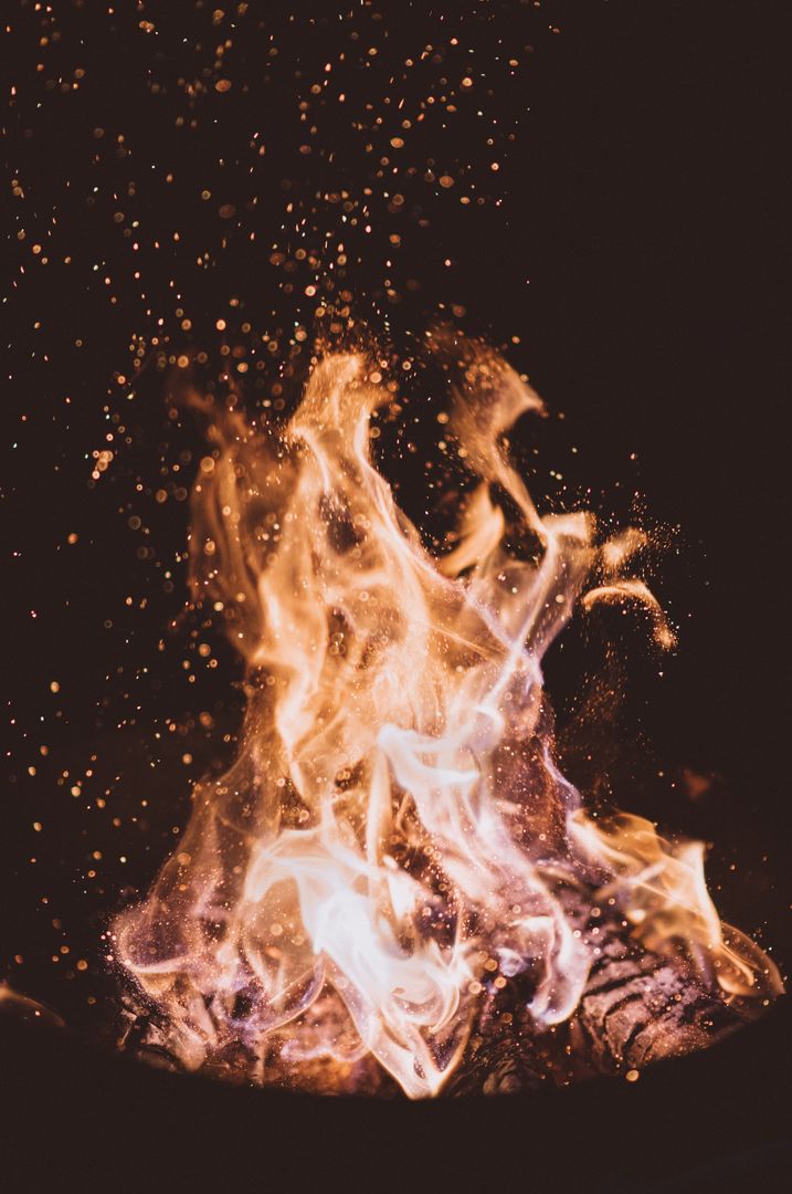 Mesmerizing Flames Dance Ethereal Sparking Nighttime Fire