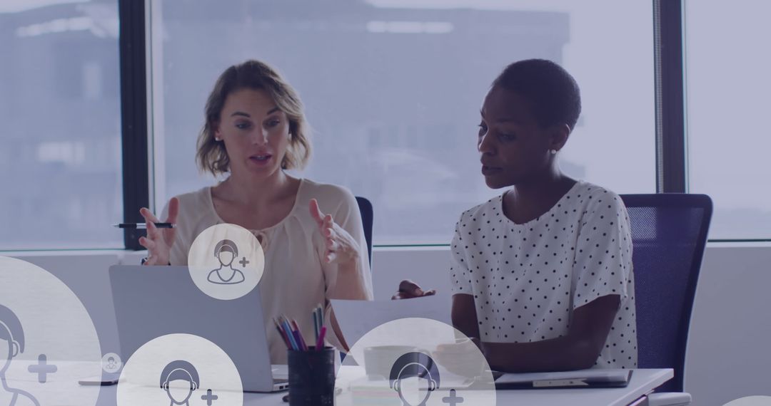 Diverse Female Colleagues Collaborating in Modern Office Setting