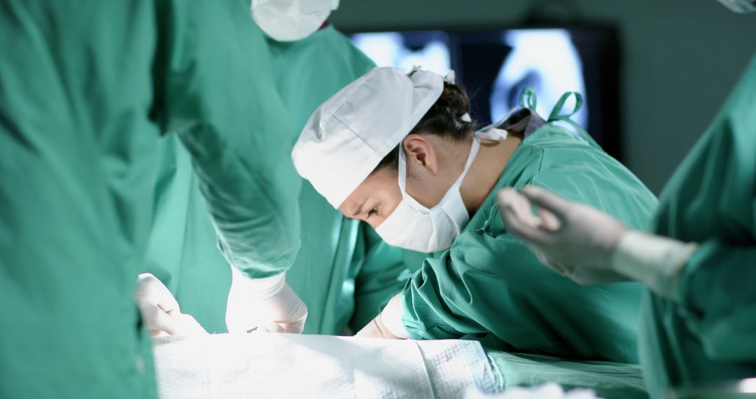 Surgeons Performing Operation in Scrub Uniforms - Free Images, Stock Photos and Pictures on Pikwizard.com