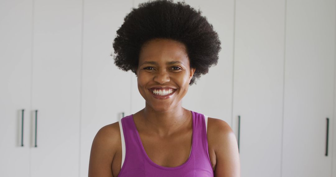 Smiling African American Woman in Pink Tank Top - Free Images, Stock Photos and Pictures on Pikwizard.com