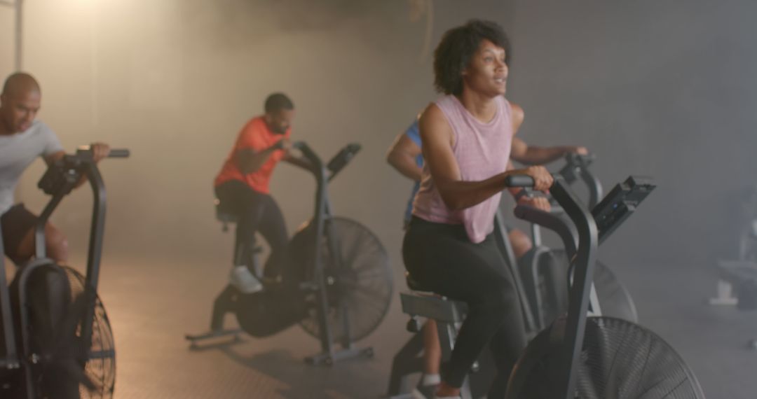 Energetic Group Cycling Class in Modern Gym - Free Images, Stock Photos and Pictures on Pikwizard.com