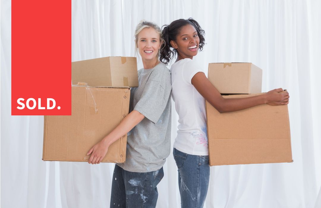 Smiling Women with Moving Boxes Celebrating New Home Purchase - Download Free Stock Templates Pikwizard.com