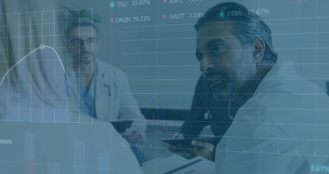 Doctors Analyzing Financial Data in Medical Setting