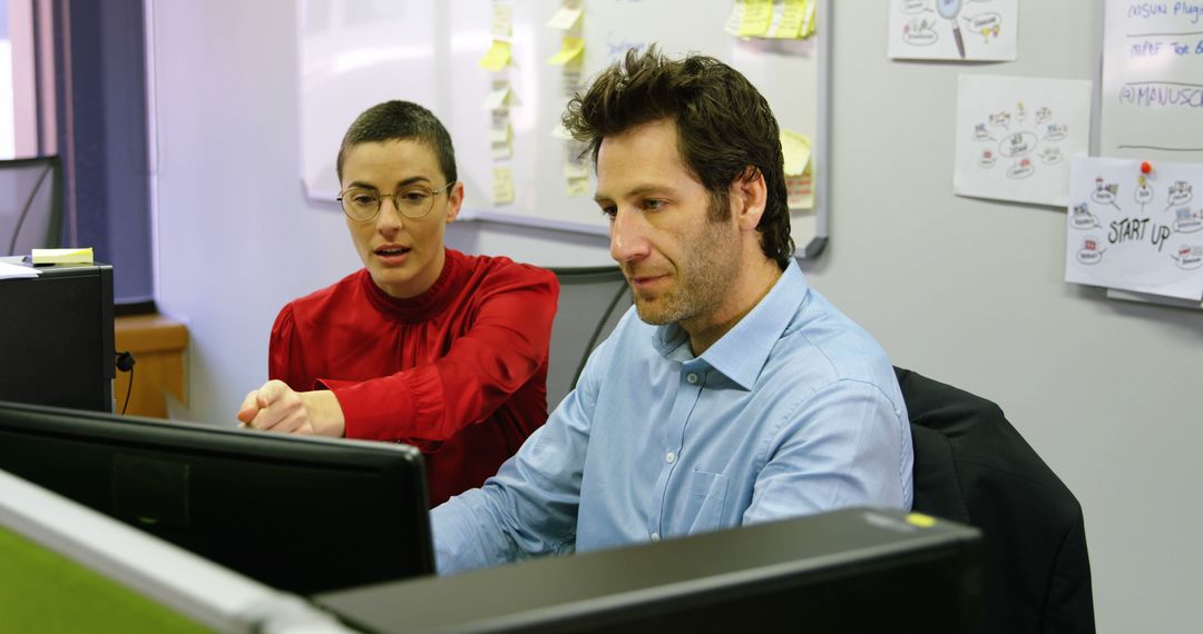 Collaborating Team Members at Computer in Modern Office Environment - Free Images, Stock Photos and Pictures on Pikwizard.com