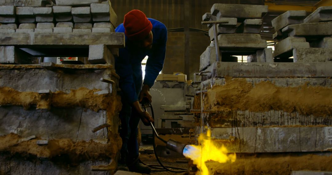 Steelworker Using Welding Torch in Industrial Foundry - Free Images, Stock Photos and Pictures on Pikwizard.com