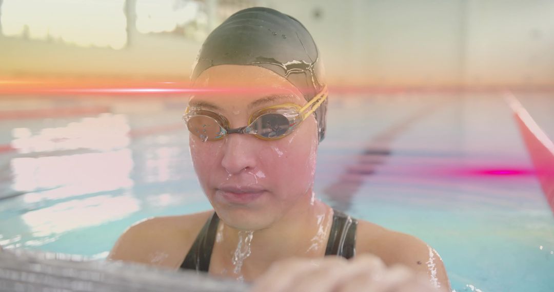 Serious Female Swimmer in Pool Preparing for Race