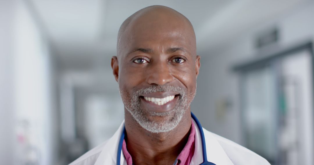 Smiling African American Doctor in Hospital Hallway - Free Images, Stock Photos and Pictures on Pikwizard.com