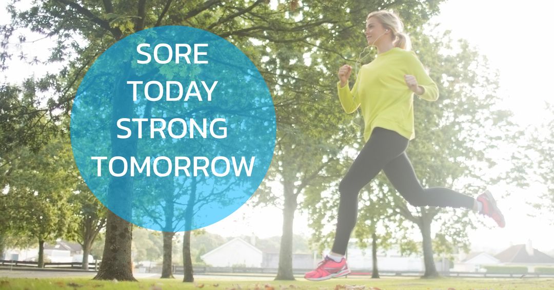 Woman jogging in park with inspirational fitness quote