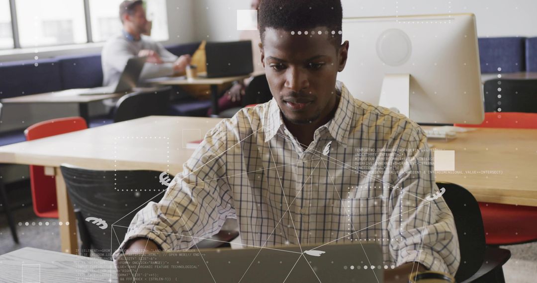 Man Typing at Laptop in Modern Office with Digital Overlay