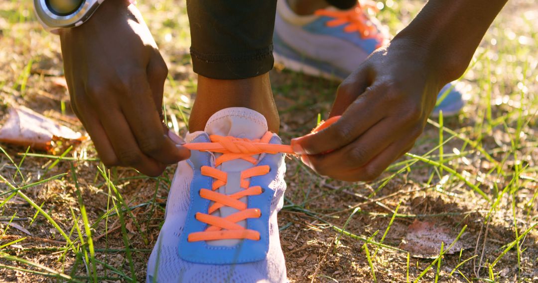 Close-up of Runner Tying Sneaker Laces Outdoors - Free Images, Stock Photos and Pictures on Pikwizard.com