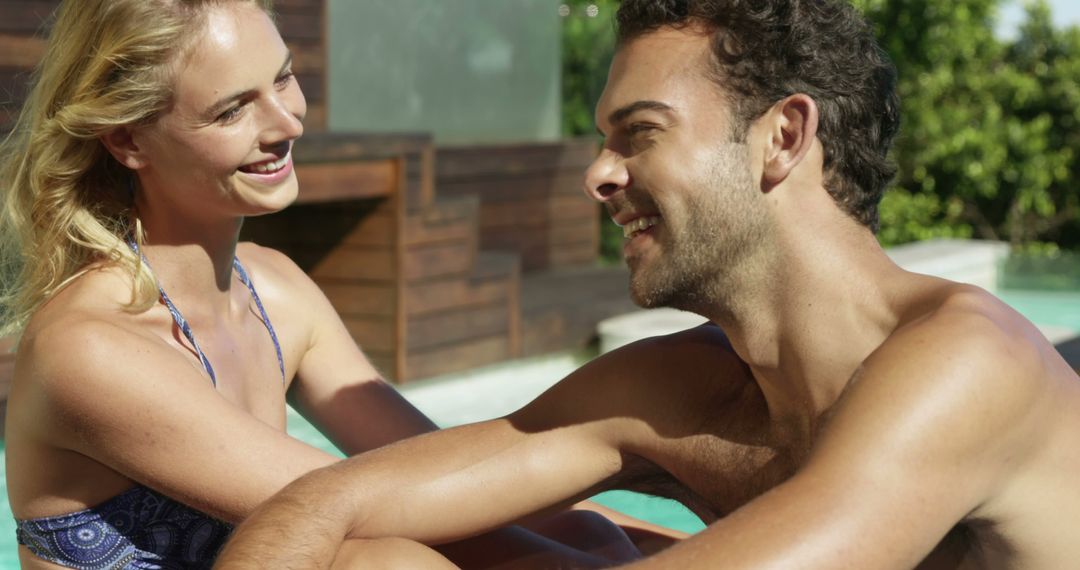 Couple Relaxing in Pool and Smiling at Each Other - Free Images, Stock Photos and Pictures on Pikwizard.com
