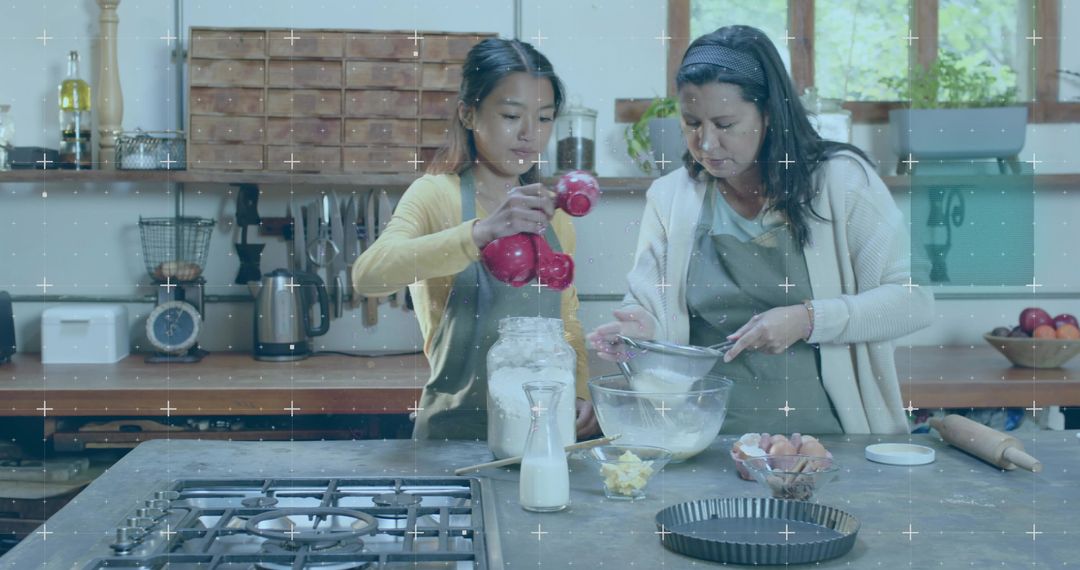 Mother and daughter baking in rustic kitchen pouring flour and sifting ingredients