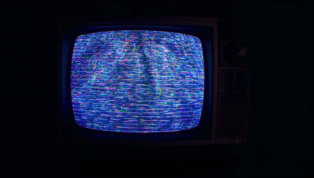 Retro Flickering CRT Television Displaying Static in Darkness