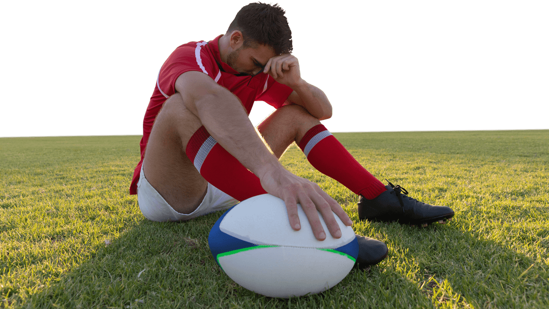 Caucasian Rugby Player Reflecting on Field with Rugby Ball, Transparent Background